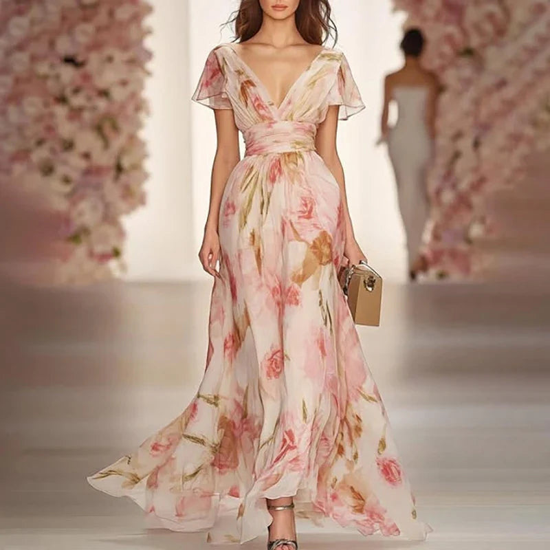 Elegant floral chiffon maxi dress with flutter sleeves and a flowing silhouette for weddings and special occasions.