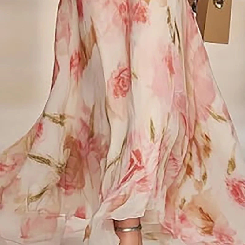 Elegant floral chiffon maxi dress with flutter sleeves and a flowing silhouette for weddings and special occasions.