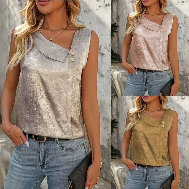 Woman wearing sleeveless satin top with asymmetrical neckline and button detail in champagne, pink, and gold
