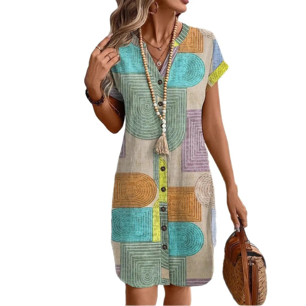 Front view of multicolor geometric print button-front dress with V-neck and short sleeves.